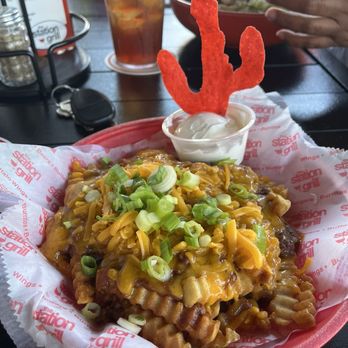 The Station Grill - Chili cheese fries without the tomato - Burgers Near Me - Muskegon, Michigan The Station Grill - Chili cheese fries without the tomato - Burgers Near Me - Muskegon, Michigan