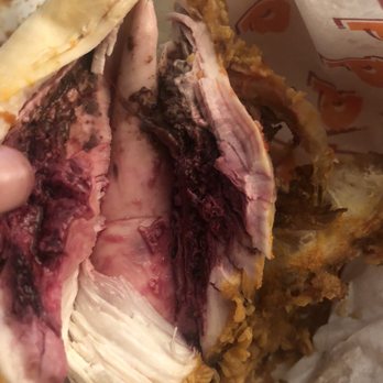Popeyes Louisiana Kitchen - a hand holding a sandwich - Fast Food Near Me - Lemoore, California Popeyes Louisiana Kitchen - a hand holding a sandwich - Fast Food Near Me - Lemoore, California