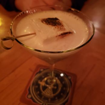 McMenamins North Bank - A toasted marshmellow mixed drink. It was very good! Notice the orange lighting in the picture. The whole place is like that inside. - Pubs Near Me - Eugene, Oregon