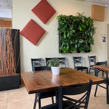 Cafe Evergreen - a table and chairs in a restaurant - Juice Bars & Smoothies Near Me - Nokomis, Florida