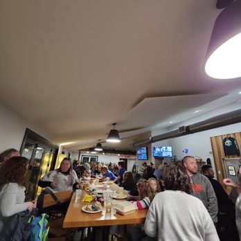 Green Valley Brewing - a large group of people sitting at a long table - Brewpubs Near Me - Hudson, Ohio Green Valley Brewing - a large group of people sitting at a long table - Brewpubs Near Me - Hudson, Ohio