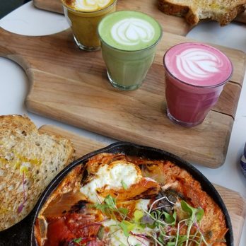 Bluestone Lane West End Café - The Green Baked Eggs and Classic BL Baked Eggs with the latte flight (turmeric, matcha, and beetroot) - Coffee & Tea Near Me - Washington, DC, District of Columbia Bluestone Lane West End Café - The Green Baked Eggs and Classic BL Baked Eggs with the latte flight (turmeric, matcha, and beetroot) - Coffee & Tea Near Me - Washington, DC, District of Columbia