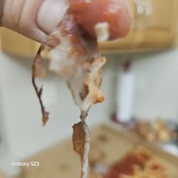 Rico's Pizzeria - Tracing paper thin pieces of pepperoni and sausage basically any topping