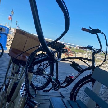 Pedego Electric Bikes Spring Lake - Our Bikes on the Boardwalk and one with a crate basket and the other with the water bottle mount. - Bike Rentals Near Me - Spring Lake, New Jersey Pedego Electric Bikes Spring Lake - Our Bikes on the Boardwalk and one with a crate basket and the other with the water bottle mount. - Bike Rentals Near Me - Spring Lake, New Jersey