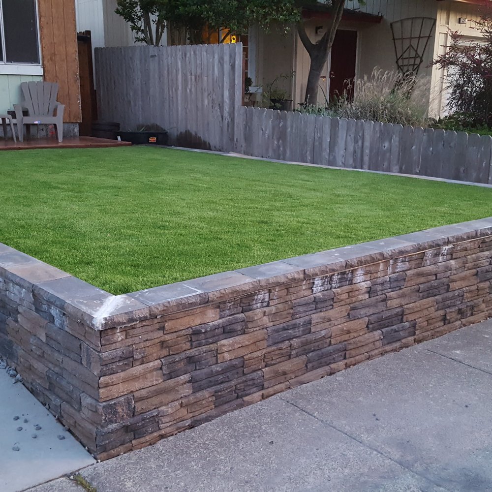 Artificial Grass Norcal - Grass went well with our new retaining wall. Model GRN94 - Artificial Turf Near Me - Roseville, California Artificial Grass Norcal - Grass went well with our new retaining wall. Model GRN94 - Artificial Turf Near Me - Roseville, California