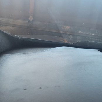 Rickenbaugh Cadillac - Left speaker not flushed due to warp dash. - Auto Repair Near Me - Denver, Colorado