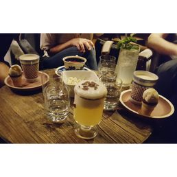Pina coladas, a hibiscus margarita in a teacup, and the Kama Sutra with a hangover (topped with a white chocolate horseradish cloud) Pina coladas, a hibiscus margarita in a teacup, and the Kama Sutra with a hangover (topped with a white chocolate horseradish cloud)