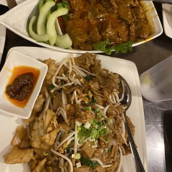 Banana Leaf - Top is Beef Rendang. Bottom is chow kueh teow. - Malaysian Near Me - Houston, Texas Banana Leaf - Top is Beef Rendang. Bottom is chow kueh teow. - Malaysian Near Me - Houston, Texas