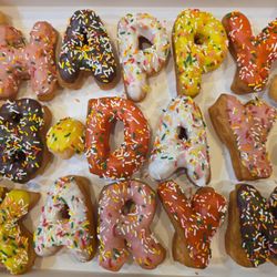 Happy Donut - Perfect letters and tasted delicious! ($3.50 per letter) Loved it!!!  Aug.2025