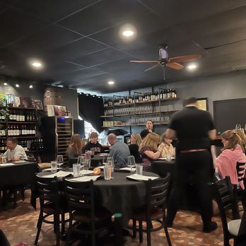 Madrigal - Dinning area (2) six person tables and (8) four person tables - Pizza Near Me - Columbia, South Carolina Madrigal - Dinning area (2) six person tables and (8) four person tables - Pizza Near Me - Columbia, South Carolina