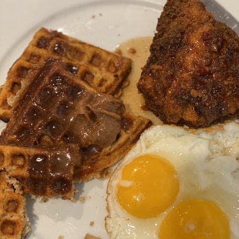 Eli's Table - Pumpkin spice waffle with cinnamon honey butter and sunny side up eggs with their marinated chicken breast! - Southern Near Me - Charleston, South Carolina