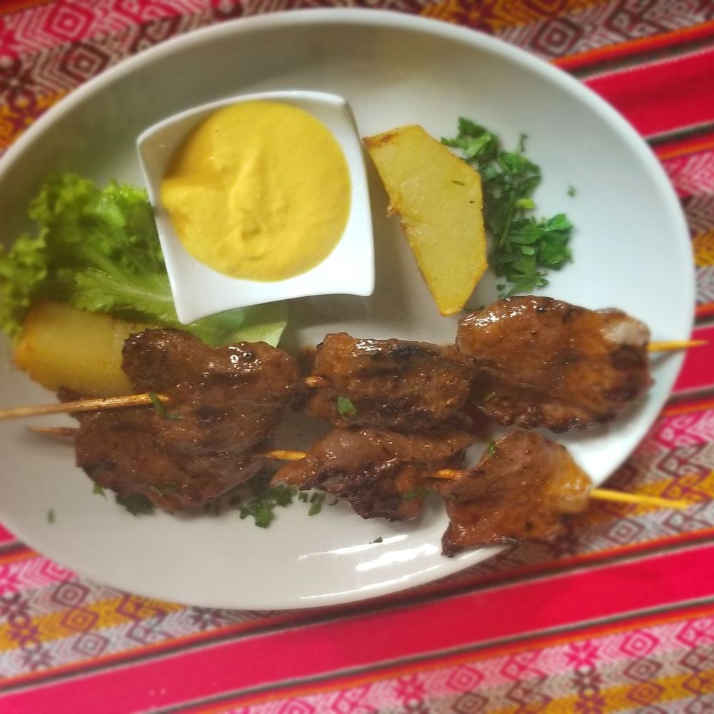 Anticuchos with papás y crema huancaina Anticuchos with papás y crema huancaina