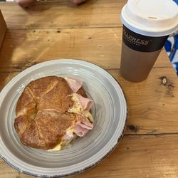 Ham and cheese croissant and a flat white