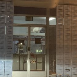 US Post Office - Times say lobby is open until 8pm yet it's 7:20pm & ALL doors are locked & chained