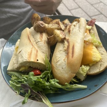 Crema Gourmet  - Breakfast sandwich and a side of potatoes. - Breakfast & Brunch Near Me - Davie, Florida