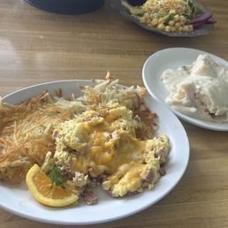 Ham & cheddar scrambled eggs with hash browns with biscuits and gravy on the side. YUM Ham & cheddar scrambled eggs with hash browns with biscuits and gravy on the side. YUM