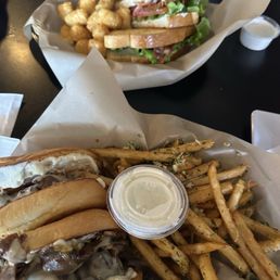 French dip deluxe sandwich and garlic fries BLT and tater tots