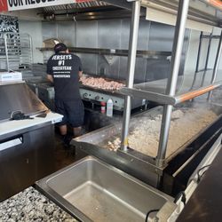 Fresh chicken breast being prepared for sandwich.