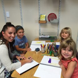 Awakening Seed School - PreK writers at work