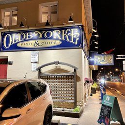 Exterior outside entrance of Olde Yorke - Looking at the restaurant building from the street corner. The main entrance is under the over hanging sign. Nov 2021 - East York, Ontario Exterior outside entrance of Olde Yorke - Looking at the restaurant building from the street corner. The main entrance is under the over hanging sign. Nov 2021 - East York, Ontario