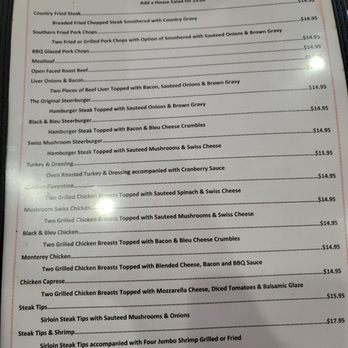 Southern Table - Menu - The menu titled 'Southern Favorites' offers a selection of Southern-style dishes including fried steak, pork chops, burgers, and chicken, with options for sides and additional toppings. Prices vary from $14.95 to $17.95. The menu emphasizes hearty, homemade-style meals with detailed descriptions of each dish and its accompaniments. - Southern Near Me - Bunnell, Florida