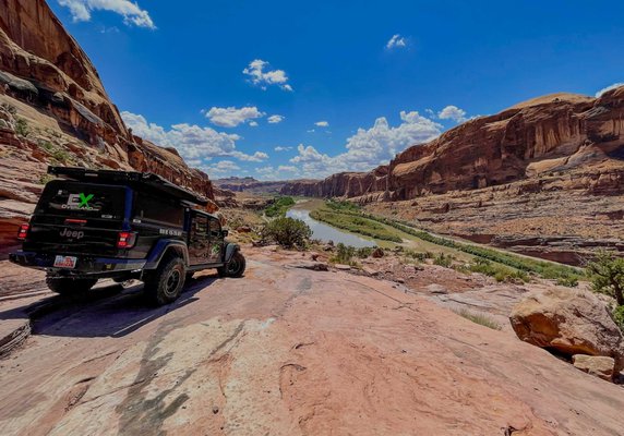 Jeep Gladiator Rubicon - If there was ever a vehicle built for overlanding, it’s the Jeep Gladiator Rubicon. If hard core, rugged, and utility is what you’re looking for, this one’s for you. With the RLD camper shell and the Roofnest Falcon 2 XL, this vehicle can sleep 4 in comfort.
The Gladiator Rubicon starts as a very sexy rig, but we have to dress it! We started with a Rubicon Express 2.5″ Monotube lift kit, then things just got out of hand. Many tens of thousand of dollars later we had the vehicle we dreamed of. If you’ve ever wanted to drive one of these beasts, why not do it with one of the most tricked out versions you can find? In addition to exceptional overland equipment we added tons of KC lighting (you really can’t put too many LED lights on an overland rig), kick-ass wheels and 37″ tires, and then we capped it with an RLD designs hard camper shell that allows this rig to sleep up to 6 with the Roofnest Falcon 2 XL tent. Jeep Gladiator Rubicon - If there was ever a vehicle built for overlanding, it’s the Jeep Gladiator Rubicon. If hard core, rugged, and utility is what you’re looking for, this one’s for you. With the RLD camper shell and the Roofnest Falcon 2 XL, this vehicle can sleep 4 in comfort.
The Gladiator Rubicon starts as a very sexy rig, but we have to dress it! We started with a Rubicon Express 2.5″ Monotube lift kit, then things just got out of hand. Many tens of thousand of dollars later we had the vehicle we dreamed of. If you’ve ever wanted to drive one of these beasts, why not do it with one of the most tricked out versions you can find? In addition to exceptional overland equipment we added tons of KC lighting (you really can’t put too many LED lights on an overland rig), kick-ass wheels and 37″ tires, and then we capped it with an RLD designs hard camper shell that allows this rig to sleep up to 6 with the Roofnest Falcon 2 XL tent.
