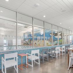 Evolution Swim Academy - A spacious viewing lobby for those that want to watch lessons and those that want to work and watch lessons.