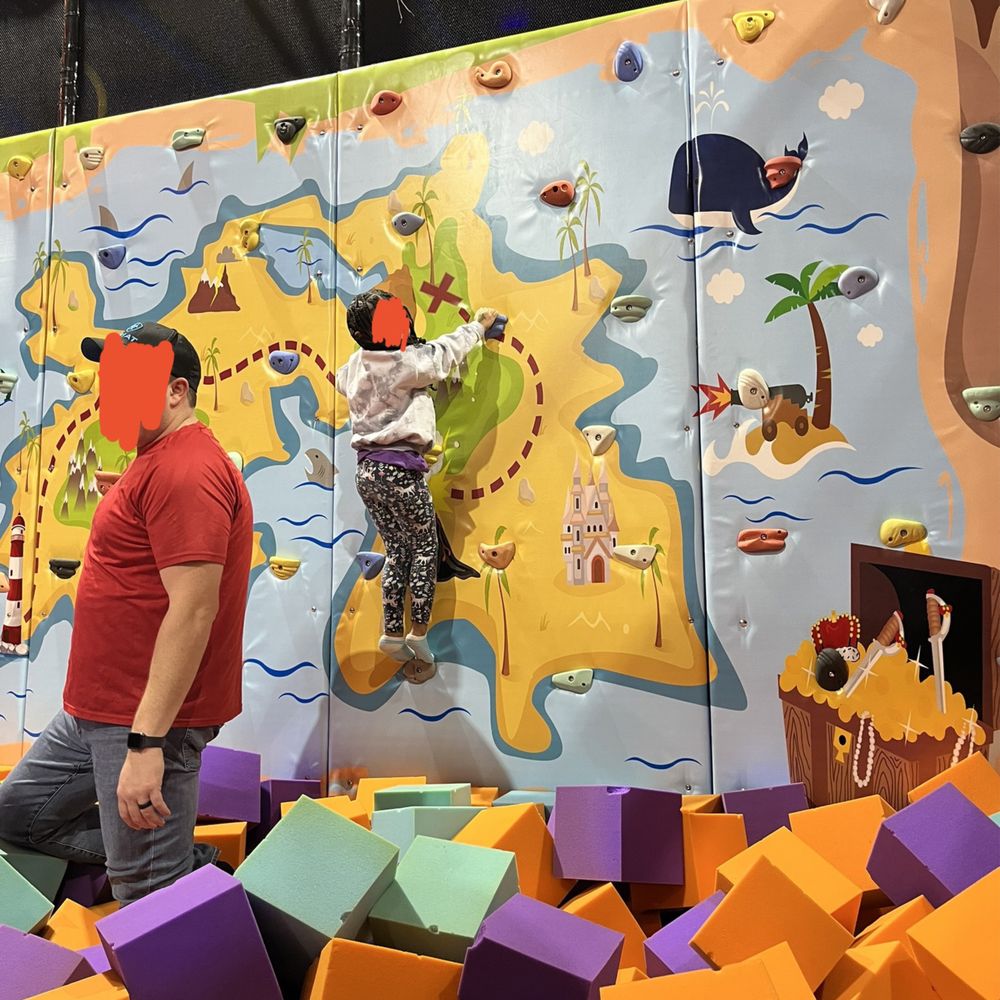 Go play! - Rock wall! The other half of this room is trampolines for jumping into the pit - Indoor Playcenter Near Me - Chesterfield, Missouri Go play! - Rock wall! The other half of this room is trampolines for jumping into the pit - Indoor Playcenter Near Me - Chesterfield, Missouri