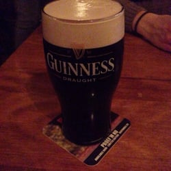 John Keating - Pinta di Guinnes con sottobicchiere della Palm Royal