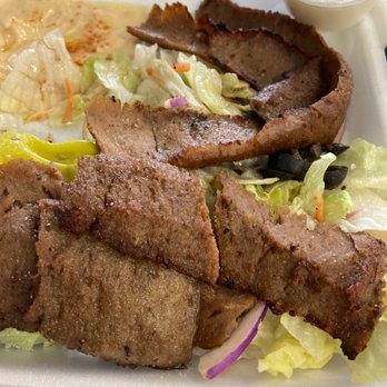 Samad Mediterranean - Gyro. Salad. Amazing hummus. Garlic sauce on top right of the picture. - Mediterranean Near Me - Sandy Springs, Georgia Samad Mediterranean - Gyro. Salad. Amazing hummus. Garlic sauce on top right of the picture. - Mediterranean Near Me - Sandy Springs, Georgia