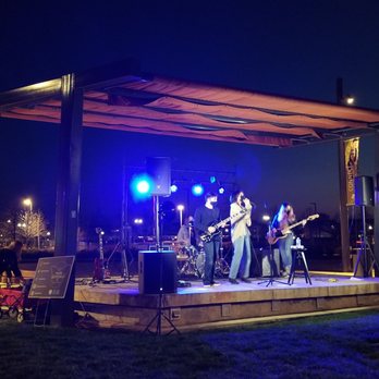 Neighborgood Markets - a band performing on a stage - Farmers Market Near Me - Elk Grove, California Neighborgood Markets - a band performing on a stage - Farmers Market Near Me - Elk Grove, California