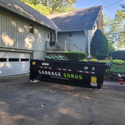 Garbage Gurus: Junk Removal Services - Delivery of a 15-yard dumpster to a residential customer in Worcester County, MA.