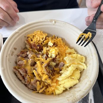 Scratch Biscuit Kitchen - Breakfast bowl- It has hash browns, eggs, cheese and your choice of protein. - Breakfast & Brunch Near Me - Santa Rosa Beach, Florida Scratch Biscuit Kitchen - Breakfast bowl- It has hash browns, eggs, cheese and your choice of protein. - Breakfast & Brunch Near Me - Santa Rosa Beach, Florida