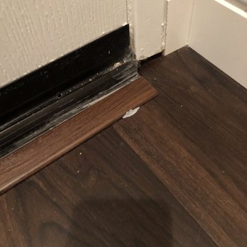 All Floors & Finishes - This was covered by blue painters tape when they left. We pulled off the tape and found this. - Flooring Near Me - Poway, California All Floors & Finishes - This was covered by blue painters tape when they left. We pulled off the tape and found this. - Flooring Near Me - Poway, California