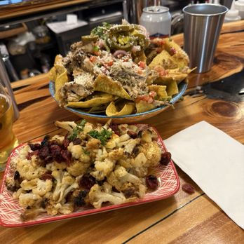 Cle Elum Taps & Tapas - Chicken verde nachos and cauliflower at the bar. - Beer, Wine & Spirits Near Me - Cle Elum, Washington Cle Elum Taps & Tapas - Chicken verde nachos and cauliflower at the bar. - Beer, Wine & Spirits Near Me - Cle Elum, Washington