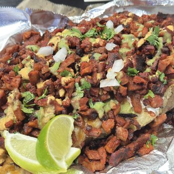 Hecho Al Carbon - La Papota (Baked Potato) with Adobada (Marinated Pork) - after I dressed it up with toppings (cilantro, onions, lime juice, salsa, guac) - Mexican Near Me - Riverside, California Hecho Al Carbon - La Papota (Baked Potato) with Adobada (Marinated Pork) - after I dressed it up with toppings (cilantro, onions, lime juice, salsa, guac) - Mexican Near Me - Riverside, California