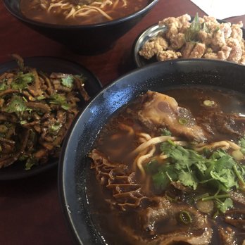 Bull Daddy Noodle Bistro - House beef noodle soup with triple and tendon (foreground), beef noodle soup, spicy tripe, and "chicken nuggets" - Taiwanese Near Me - Plano, Texas