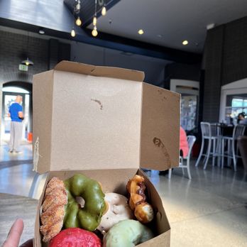 Nok's Donuts - Raspberry, green tea mochi, vanilla bean mochi, mango passion fruit, and sweet potato! - Donuts Near Me - Lafayette, Colorado Nok's Donuts - Raspberry, green tea mochi, vanilla bean mochi, mango passion fruit, and sweet potato! - Donuts Near Me - Lafayette, Colorado