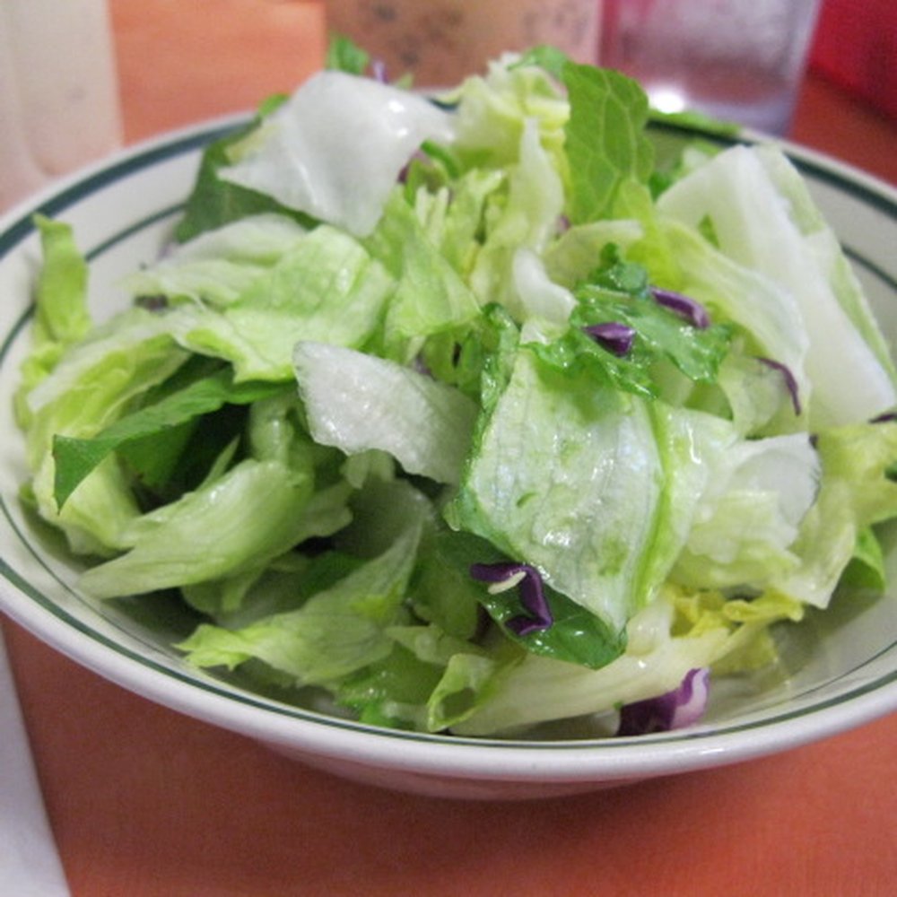 Ray's Café - each dinner came with this large bowl of green salad... - American Near Me - Honolulu, Hawaii