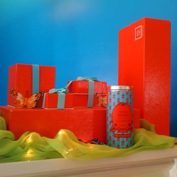 Petits Noirs - a red gift box on a mantle - Chocolatiers & Shops Near Me - Milton-Freewater, Oregon