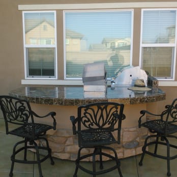 Extreme Backyard Designs - Grill and refrigerator with same materials as fireplaceand pizza oven hidden lights in front of the island. - Appliances Near Me - Ontario, California