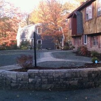 Landscape Plus - a driveway with a retaining wall - Landscaping Near Me - Goffstown, New Hampshire Landscape Plus - a driveway with a retaining wall - Landscaping Near Me - Goffstown, New Hampshire