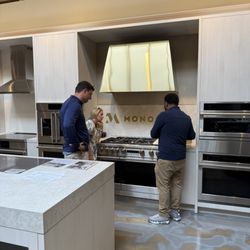Customers browsing the Monogram luxury appliances at Queen City Homestore in Pineville, NC.