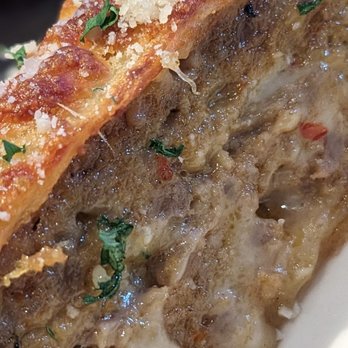 Johnny's Italian Steakhouse - Close up of Sausage bread - Steakhouses Near Me - Thornton, Colorado Johnny's Italian Steakhouse - Close up of Sausage bread - Steakhouses Near Me - Thornton, Colorado