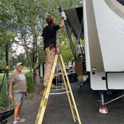 Bryan's RV &Tech Service's - Bryan cleaning the awning arm after repair was complete.