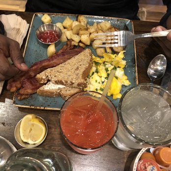 First Watch - crispy bacon, potatoes, grits,  eggs and toast...Morning meditation juice - Breakfast & Brunch Near Me - Winston-Salem, North Carolina