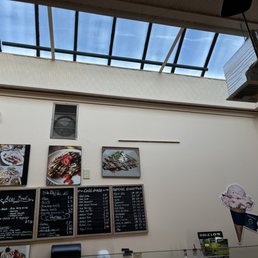 a restaurant with a skylight and menus