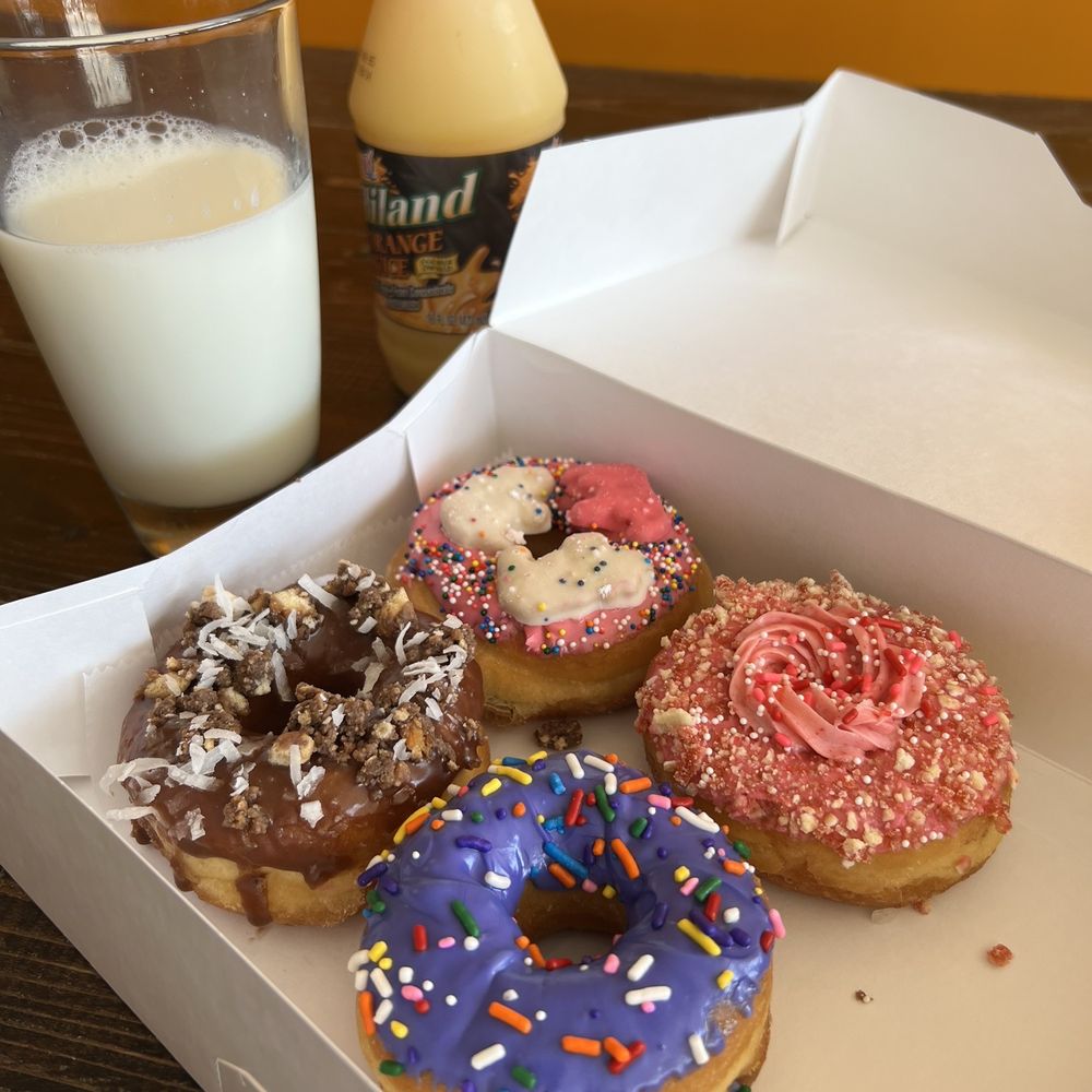 Robin’s Snowflake Donuts & Cafe - Caramel crunch, Frosted animal cookie, Strawberry shortcake, Purple frosted with sprinkles - Donuts Near Me - Spring, Texas