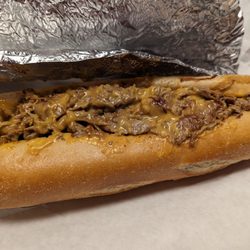 Mr R's Subs & Deli - The delicious cheese steak sub with onions, Whiz and a bite missing. Yum!