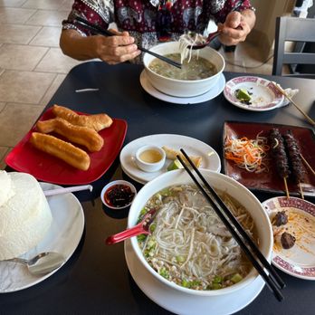 Apsara Asian Restaurant - a woman eating a bowl of noodles - Cambodian Near Me - Avondale, Arizona Apsara Asian Restaurant - a woman eating a bowl of noodles - Cambodian Near Me - Avondale, Arizona